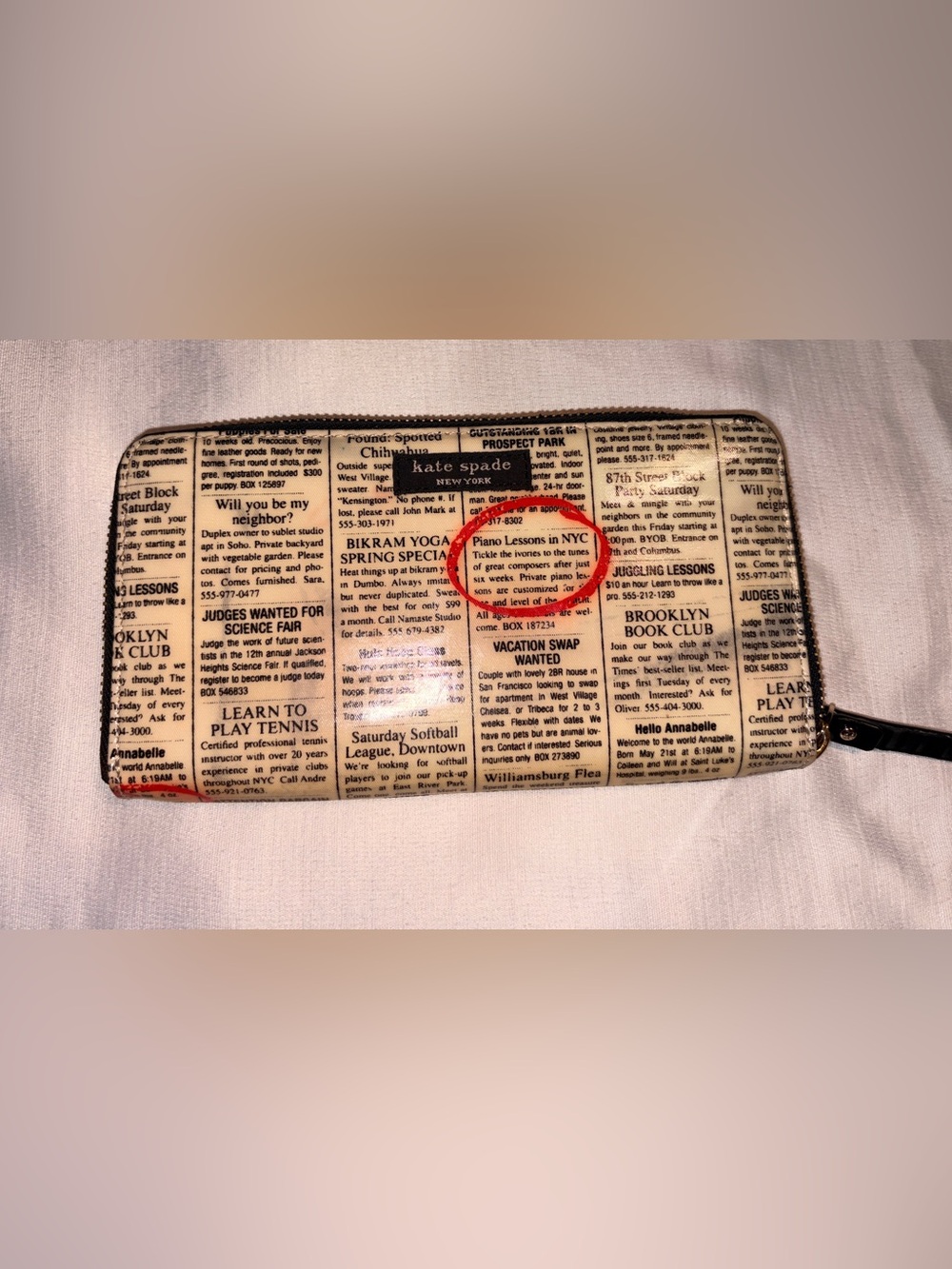 kate spade New York Newspaper Print Clutch in Beige with Black Trim and red